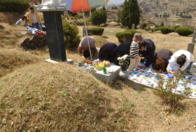 People visit ancestral graves. 