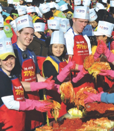 Expats make kimchi for the needy.