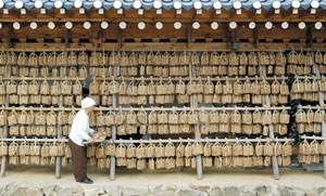 Hanging beneath the roof are blocks of meju, the fermented bean paste used to make soup in Korea.