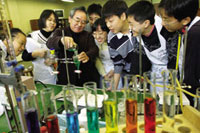 Middle school students studying chemistry in their laboratory