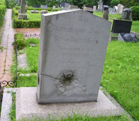 Tombstone that bears the scar of the Korean War (1950-53)