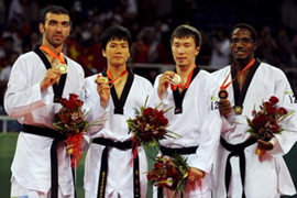 Medalists pose for photographers on the podium for the Men’s +80kg Taekwon-Do on Aug. 23 In this From left to right: silver medalist Alexandros Nikolaidis of Greece, gold medalist Cha Dongmin of Korea, bronze medalists Arman Chilmanov of Kazakhstan and Chika Yagazie Chukwumerije of Nigeria. (Source: AP-Yonhap News)