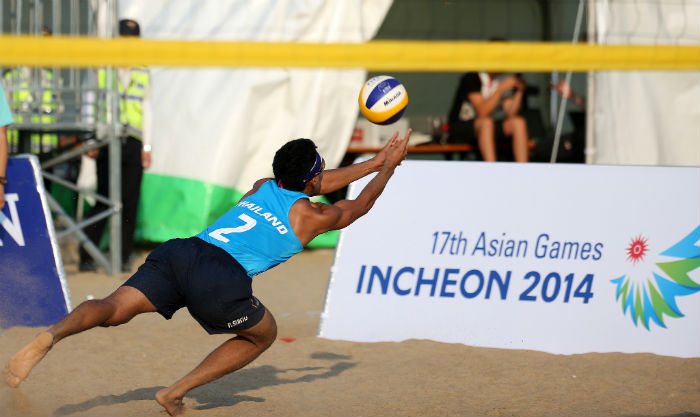 In a Group H men's beach volleyball preliminary match, Thailand, in blue, plays against Tajikistan at the Songdo Beach Volleyball Venue on September 20. 