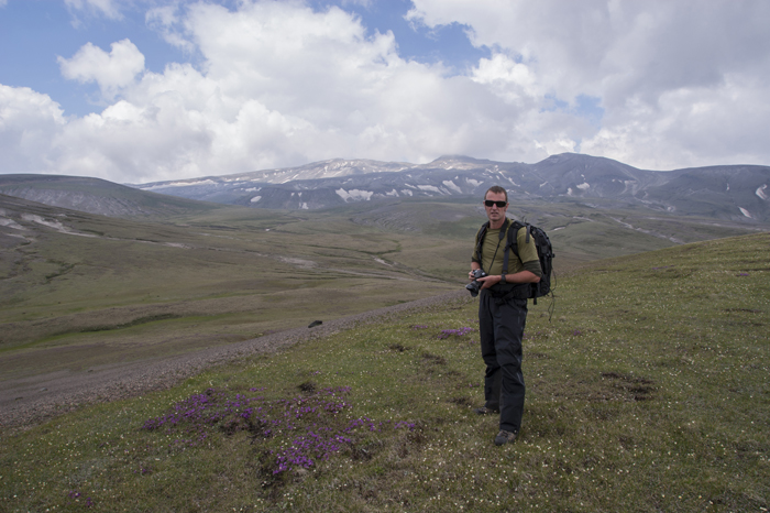 Roger Shepherd stands at the foot of Baekdusan Mountain (2,750 meters) (백두산, 白頭山, White Top Mountain) in North Korea in June 2012. (photo: Roger Shepherd)