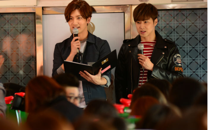 The members of TVXQ, Max Changmin (left) and U-know Yunho, hosted a train trip across Korea for around 250 of their fans on March 24. 
