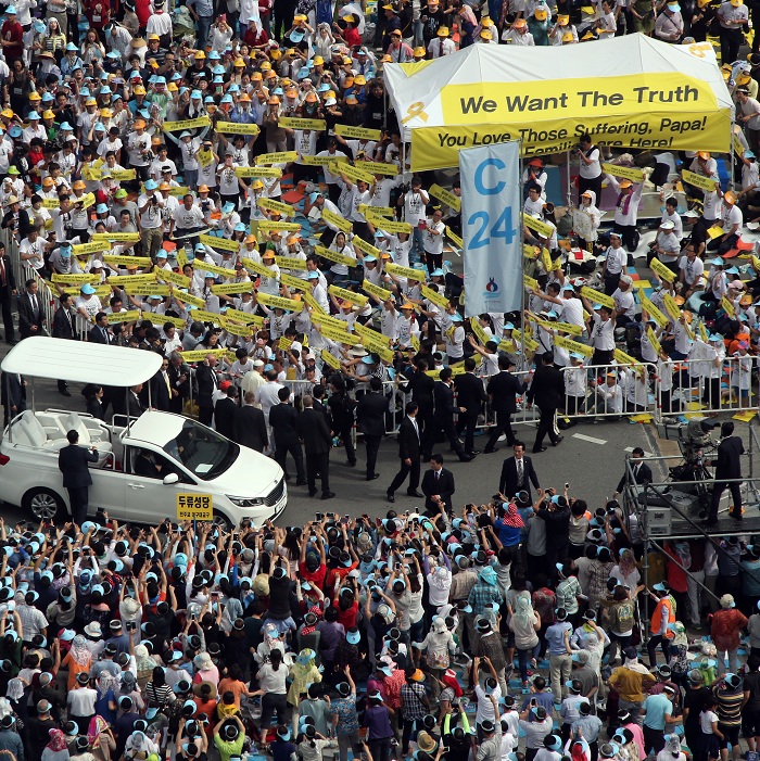 The pope stopped his open-topped car at a group of family members of victims of the Sewol ferry disaster, and consoled and blessed them.