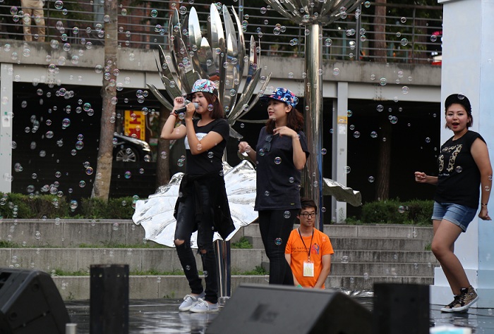 A group of teens dances during the K-pop Summer Concert.