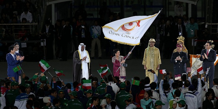 The torch and OCA flag are handed over to Indonesia, the next host country of the Asian Games.