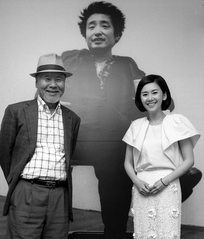 Three artists -- Kim Hyun-jung (right), the late Paik Nam June (photograph, center) and Lee Wol Chong -- are invited to take part in the "One Divided Into Three: The Exhibition of Three Korean Artists" exhibition in Beijing. 
