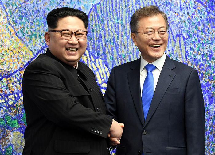 President Moon Jae-in (right) and North Korean leader Kim Jong Un hold a brief chat prior to their summit, in the lobby of the Peace House, the venue for the 2018 Inter-Korean Summit, in Panmunjeom on April 27.