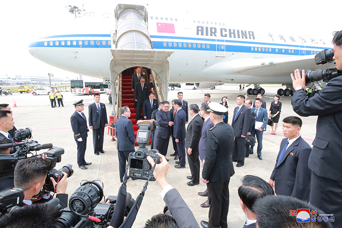 Chairman of the State Affairs Commission Kim Jong-un is welcomed by Singaporean officials upon his arrival at Changi Airport in Singapore on June 10 for the North Korea-U.S. summit.
