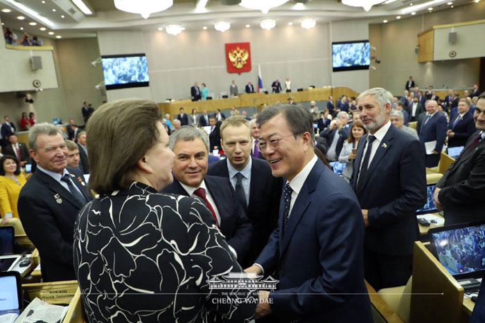 President Moon Jae-in is greeted by members of the Russian parliament after finishing his address at the State Duma in Moscow on June 21.