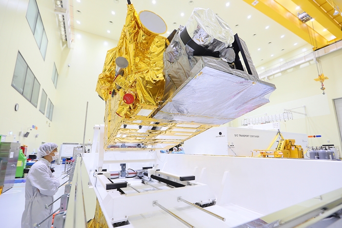 The new Chollian-2A geostationary weather satellite, to be launched from the Guiana Space Center at Kourou in French Guiana on Dec. 4 (local time), is being prepared for relocation by a researcher at the Korea Aerospace Research Institute (KARI) in Daejeon on Oct. 16. (Ministry of Science and ICT)