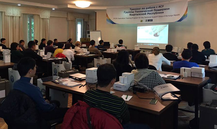Kyrgyzstani citizens and officials learn how to use an automated voting system. In order to build the automated electoral system in Kyrgyzstan, Korea provided educational and training programs for local election officials.