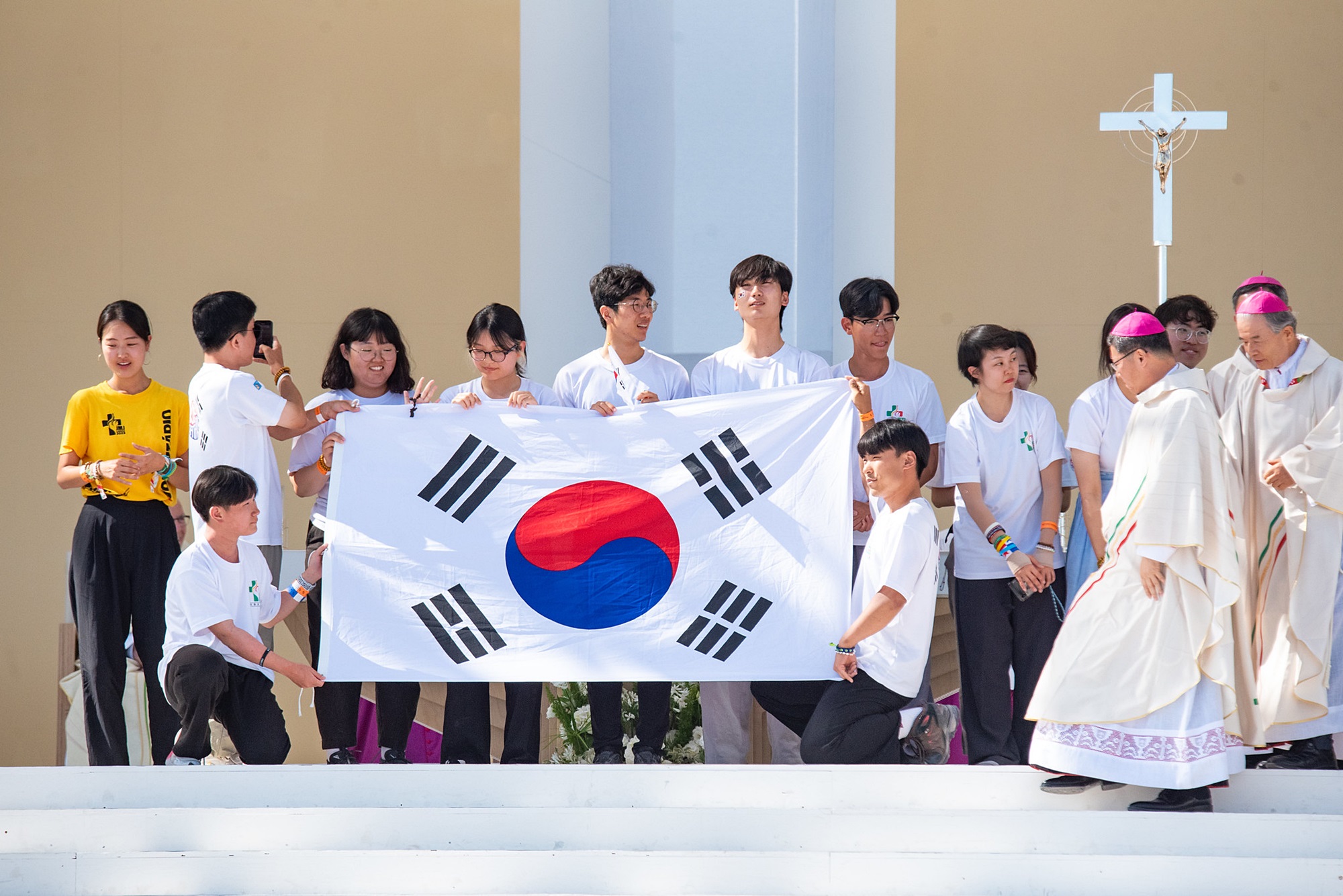 Members of a Korean Catholic delegation including two archbishops on Aug. 6 celebrate Seoul's selection as the host city of the 2027 World Youth Day at the closing Mass of this year's event in Lisbon, Portugal.(Official Flicker account of 2023 World Youth Day) 