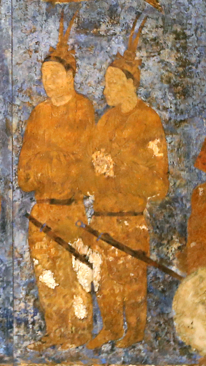 Historians suggest that the two people on the right, wearing hats with feathers and carrying swords with round pommels, are presumed to be from Goguryeo. A copy of the restored wall painting is on display at the National Museum of Korea.