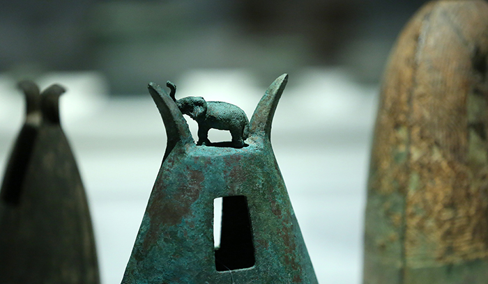 Bronze musical instruments are some of the most-found artifacts at Dong Son archeological digs. The bell in the center has two horns and is decorated with an elephant-shaped ornament. (photo: Jeon Han)