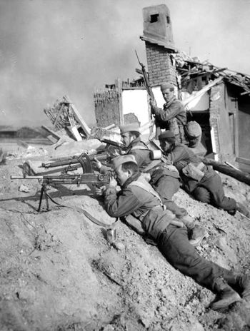 Highlanders overlook the ruins of Chongju, Pyeonganbuk-do (North Pyeongan Province) just 30 miles south of the Yalu River in the winter of 1950. Soldiers were told the war was almost over, but recall a strange menace settling over the battlescape. Just days later, these men would be fighting for their lives as China entered the war (photo courtesy of State Library of Victoria).