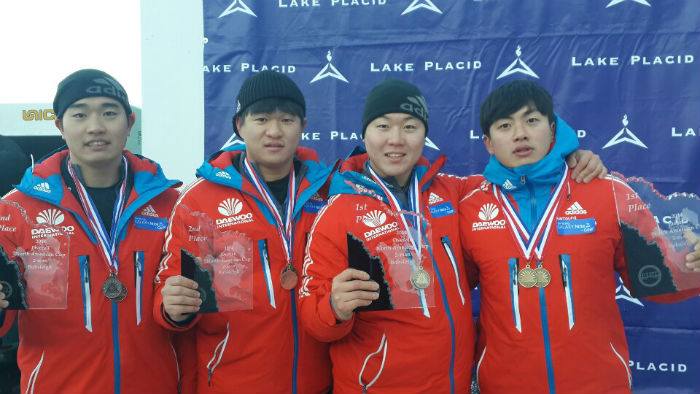 The men’s bobsleigh team poses for a photo after winning Korea’s first-ever gold medal at the America Cup in Lake Placid, U.S., on January 10. The athletes in the photo are (from left) Chun Jung-rin, Kim Dong-hyun, Won Yoon-jong and Seo Young-woo. (Photo courtesy of the Korea Bobsleigh and Skeleton Federation)