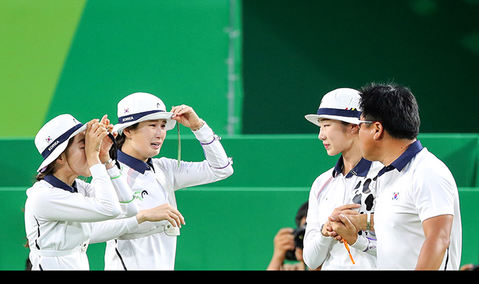 Chang Hyejin, Ki Bobae and Choi Misun can't stop crying as they win the women’s archery team competition on Aug. 7.