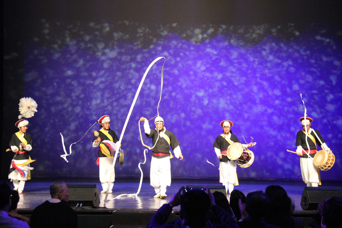  Performers of <i>pangut</i>, a traditional Korean style of folk music and dance, wear a cap and play the double-headed drum, creating a rousing atmosphere. Compared to <i>samulnori</i>, a traditional percussion quartet which usually sits and performs, </i>pangut</i> performances are much more active. 