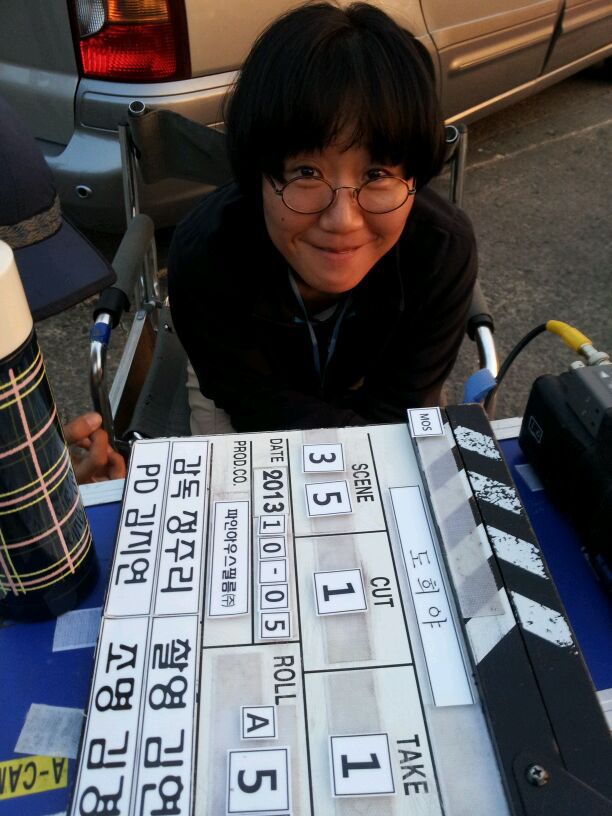  Jung July poses for a photo while filming 'A Girl at My Door.' 