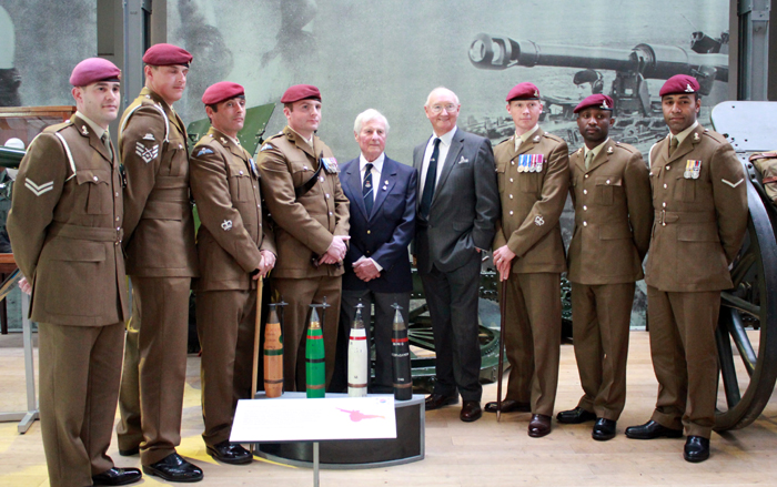 Banner artist Doug Leyland (center) and British soldiers participate in the donation ceremony at the Royal Artillery Museum in Woolwich, London, on May 13.
