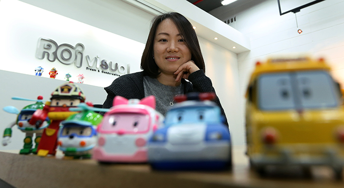 Director Eum Jun-young poses with toys from “Robocar Poli.” (photo: Jeon Han)