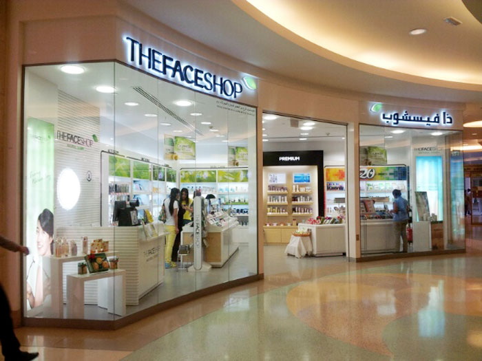 Customers look around a Faceshop outlet at a shopping mall in Dubai.