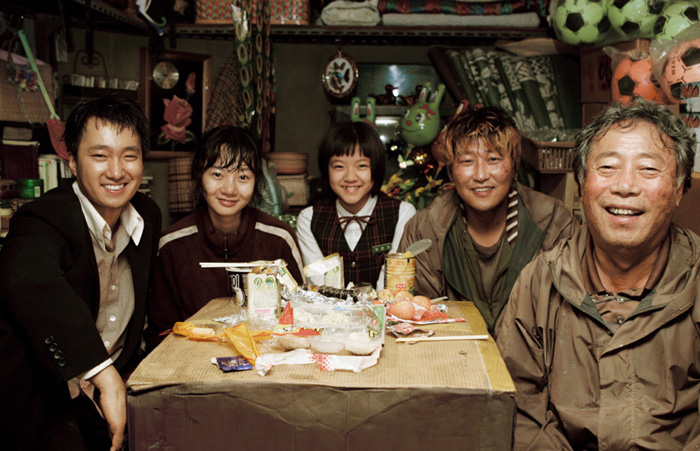 The movies (from top) “Romantic Papa,” “Rainy Days” and “The Host” are three of the eight films included in the DVD collection “Family on Screen: Understanding Korean Society and Family through Films.” (Photo courtesy of the KOFA)