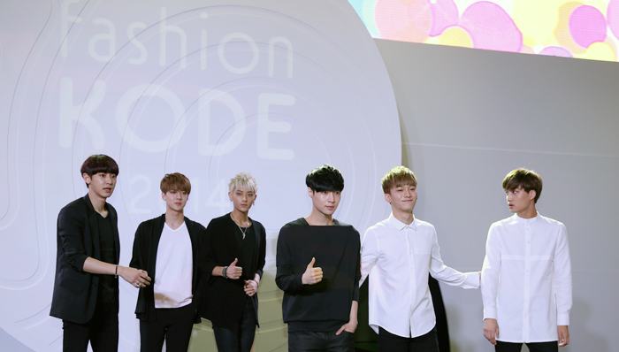 Members of EXO, (from left) Chanyeol, Sehun, Tao, Lay, Chen and Kai, pose for a photo at the opening of Fashion KODE 2014 on July 16 (photo: Jeon Han)