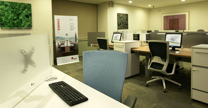An office environment is recreated inside a Fursys showroom.
