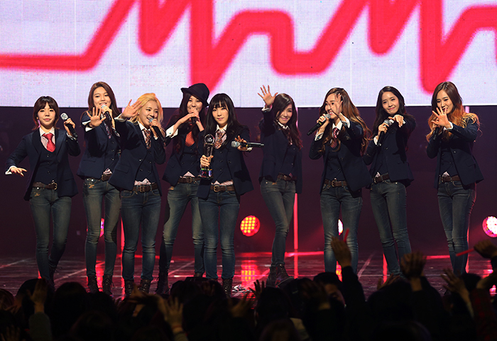 Girls’ Generation (SNSD) waves to the fans during their encore performance after winning M.net’s M! Countdown. This was their first performance in over a year. (photo : Jeon Han)