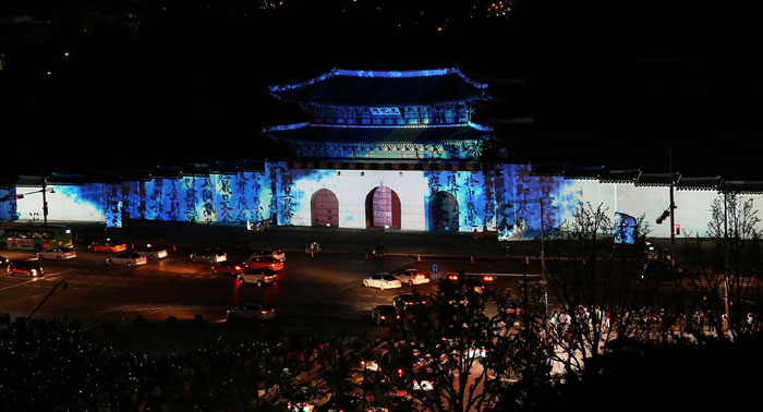 A light and music show shines upon the Gwanghwamun Gate of Gyeongbokgung Palace.