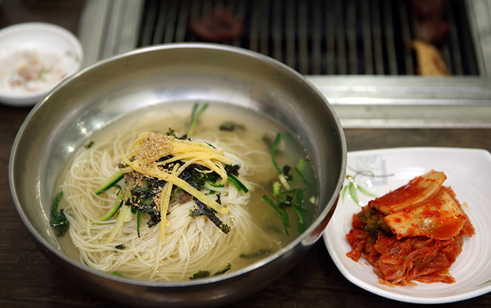 A bowl of savory noodles is served after the beef, to help freshen your palate.