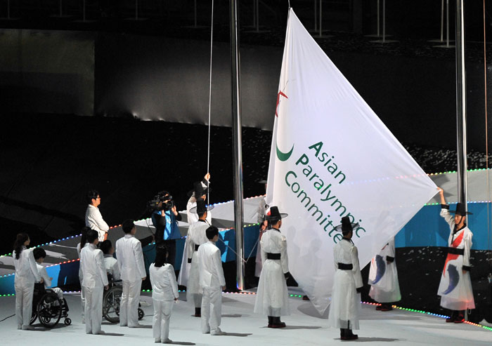The flag of the Asian Paralympic Committee is raised during the opening ceremony of the Incheon Asian Para Games. 
