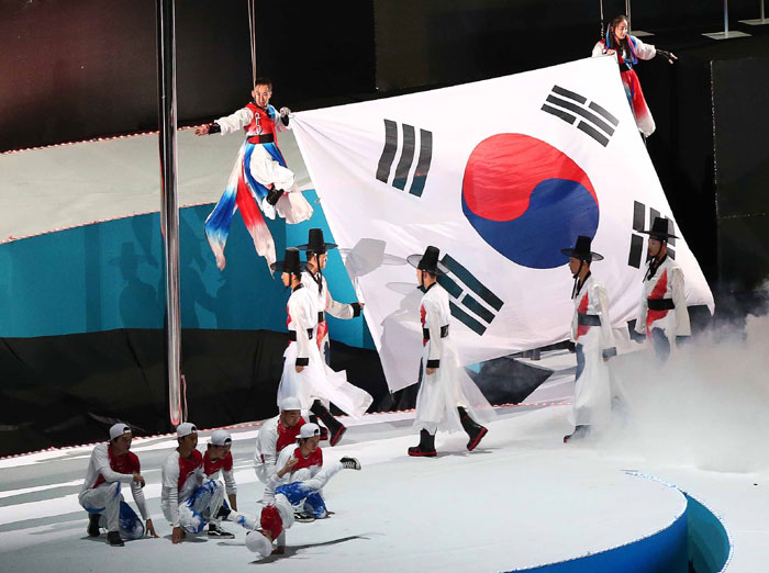 The host country's national flag is raised during the opening ceremony of the Incheon Asian Para Games.