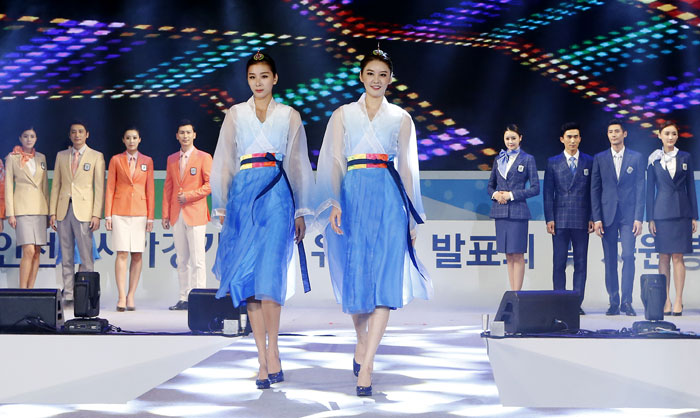 Models showcase the uniforms to be worn by award ceremony aides during the upcoming Incheon Asian Games 2014. (photo courtesy of the IAGOC)