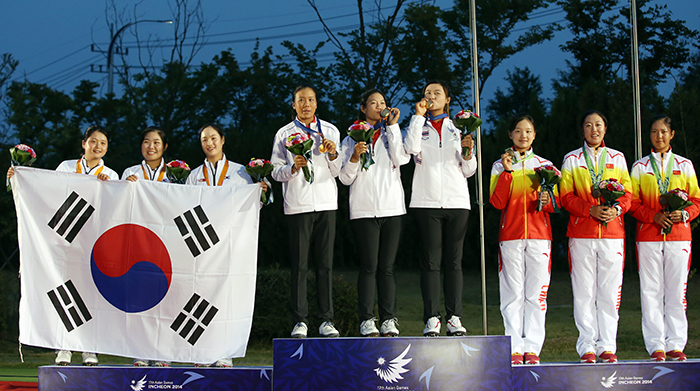  Golfers in the women's team competition celebrate their medals on the podium during the 17th Asian Games in Incheon on September 28. Thailand won gold, Korea got silver and the mainland Chinese team finished in third place. 