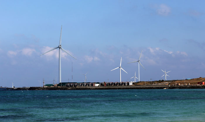 Giant wind turbines can be found on Jejudo Island. These energy generators can be seen from the Woljeongni Beach.