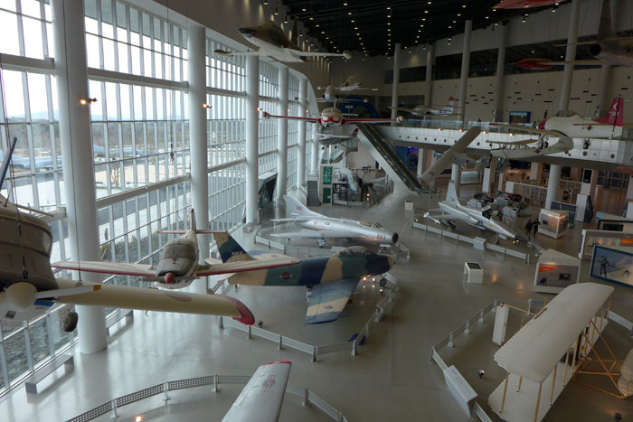 Airplanes are hung from the ceiling. These planes were all at one time used by the Korean Air Force. 