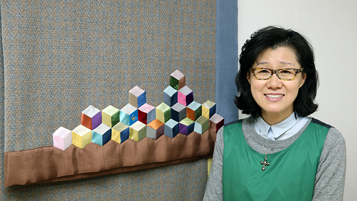Kang Keum Seong of ViiN Collection has succeeded with the traditional <i>jogakbo</i> patchwork quilting method by using traditional <i>jogakbo</i> patterns to create modern bedding and clothes, items which people use every day.
