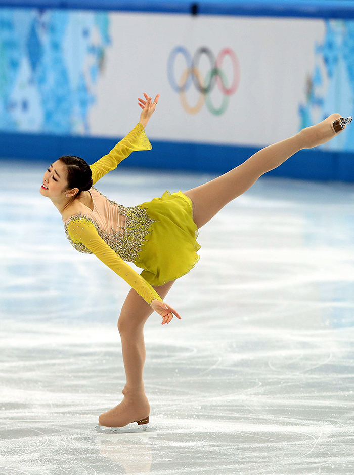 Kim Yuna performs an elegant spiral to “Send in the Clowns” in the ladies’ short program at the Sochi 2014 Winter Olympics. (photo courtesy of the Korean Olympic Committee)