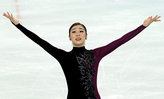 The “Queen of Figure Skating,” Kim Yuna, salutes her fans with arms open wide after finishing her free skating program at the Sochi Olympic Games on February 20, 2014. (photo courtesy of the Korean Olympic Committee)