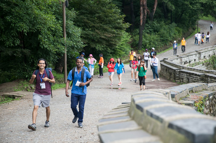 Tour participants walk along the fortress walls.