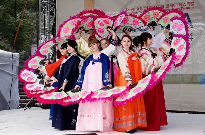  Students studying Korean language at Poznan University in Poland perform the <i>buchaechum</i>, a traditional Korean fan dance. (photo courtesy of the Korean Cultural Center Warsaw)