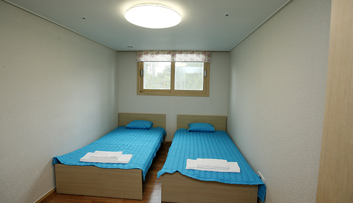 Inside a bedroom of a unit at the athletes’ village