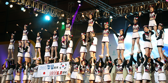 The cheerleading team Braves from Nippon Bunri University performs to mark the PyeongChang 2018 Olympic and Paralympic Winter Games and the Tokyo 2020 Olympic and Paralympic Games, during the opening ceremony for the Korea-Japan Festival in Seoul on Sept. 24.