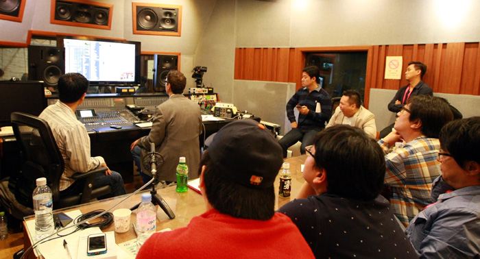 Tony Maserati, a US record producer, shares his expertise in audio engineering and programming with a group of musicians.  