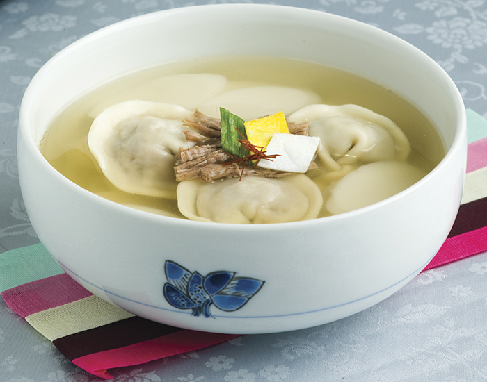 <i>Manduguk</i> is a dumpling soup enjoyed widely across northern areas of Korea. It's another popular dish that people enjoy on the morning of Lunar New Year’s Day. Many people believe that they have good luck wrapped up in the dumplings and that they'll be lucky by eating the dish.